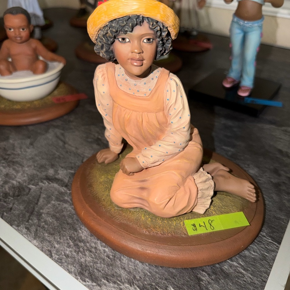 Charming Figurine with Yellow Hat